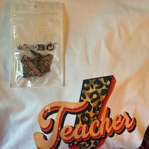 Teacher printed polyester shirt and teacher earring set.